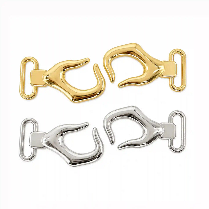 ANI Accessories belt hook buckle shown open, two separate halves in gold and silver with white color Background 
