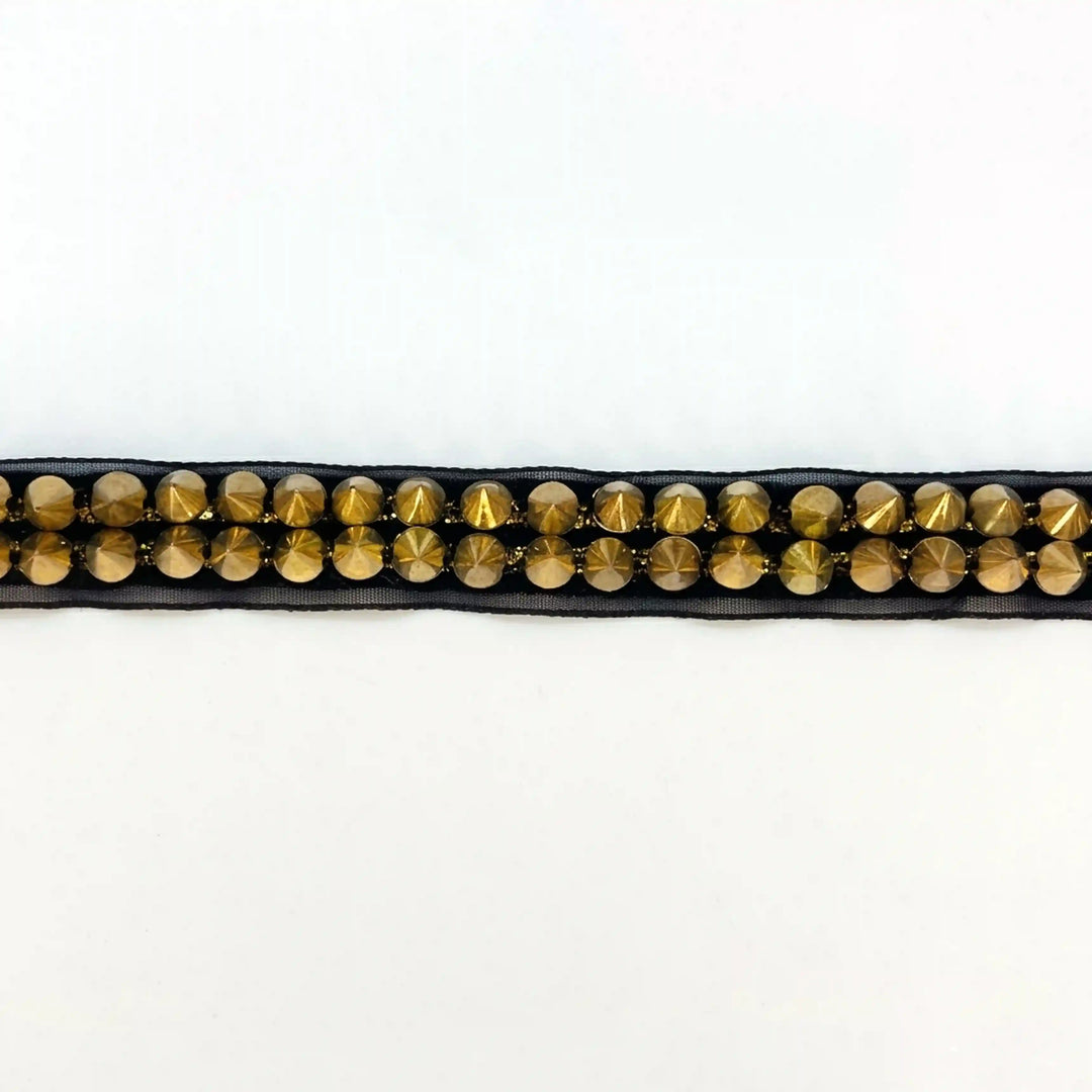 ANI Accessories black and gold stud lace laid flat on white background 
