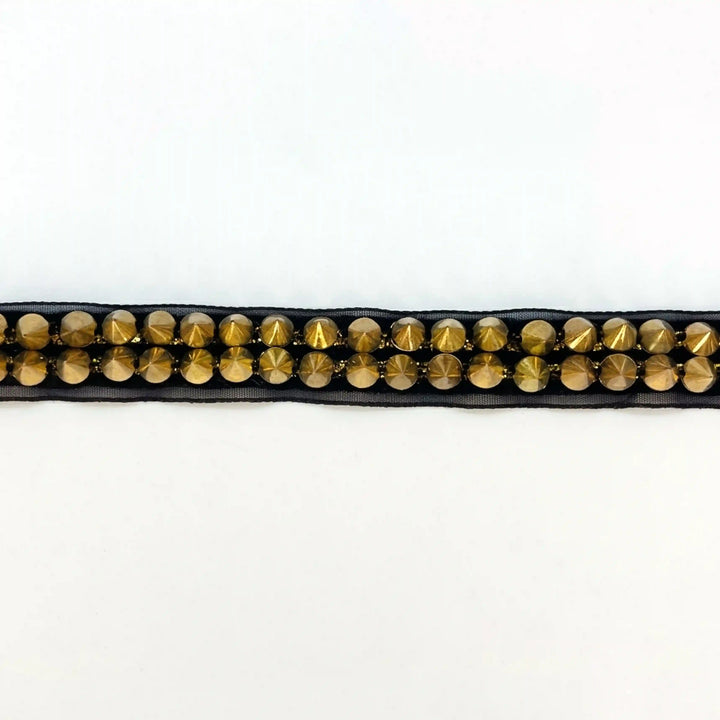 ANI Accessories black and gold stud lace laid flat on white background 