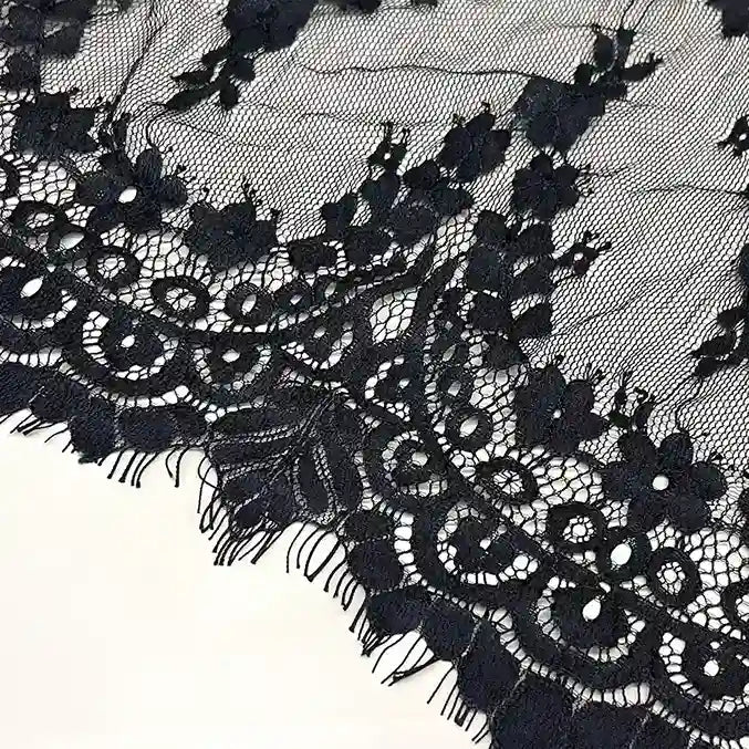 ANI Accessories close-up of the scallops and eyelash edge on black lace border for saree with white color background 
