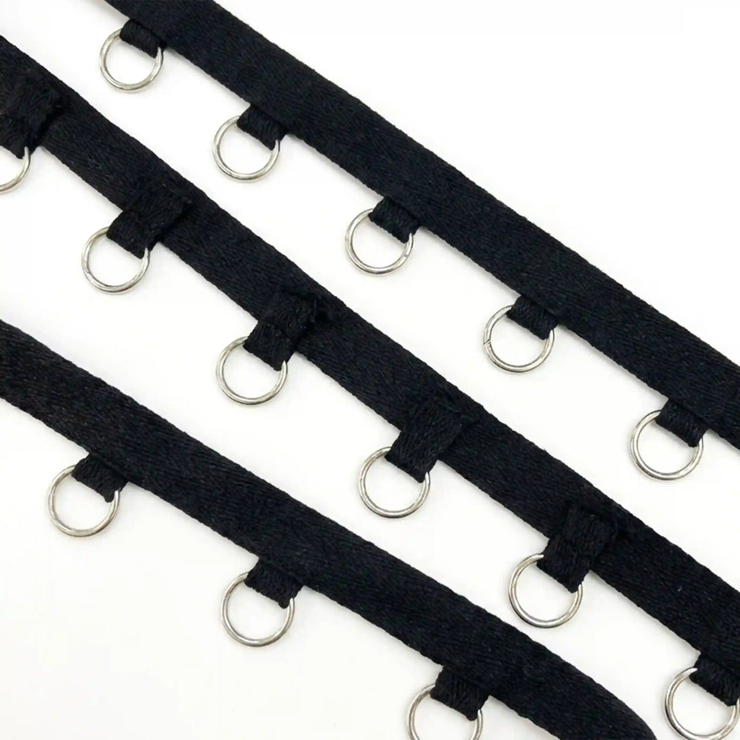 ANI Accessories black lace-up tape with silver O-rings in three rows with white color background 