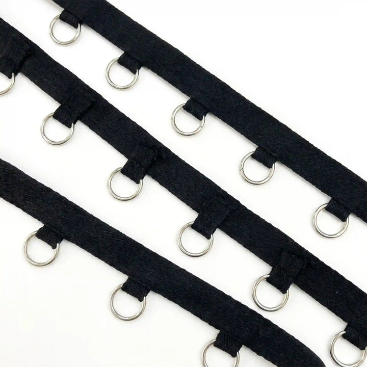 ANI Accessories black lace-up tape with silver O-rings in three rows with white color background 