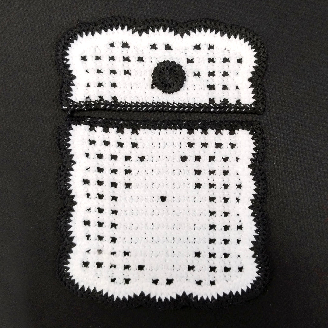ANI Accessories black and white crochet pocket patch with flap and button detail, on black Background 