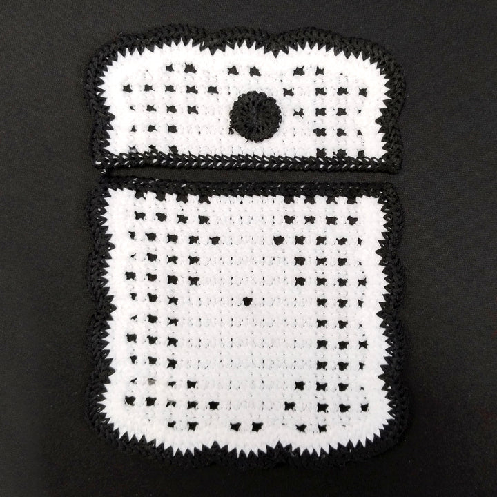 ANI Accessories black and white crochet pocket patch with flap and button detail, on black Background 