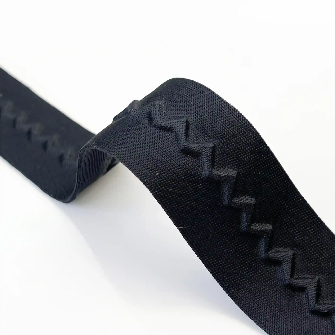 ANI Accessories close-up of raised zig zag line on black lace border with white color background 