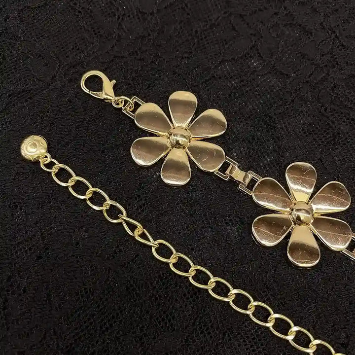 ANI Accessories close-up of bright gold metal daisies and lobster clasp
 