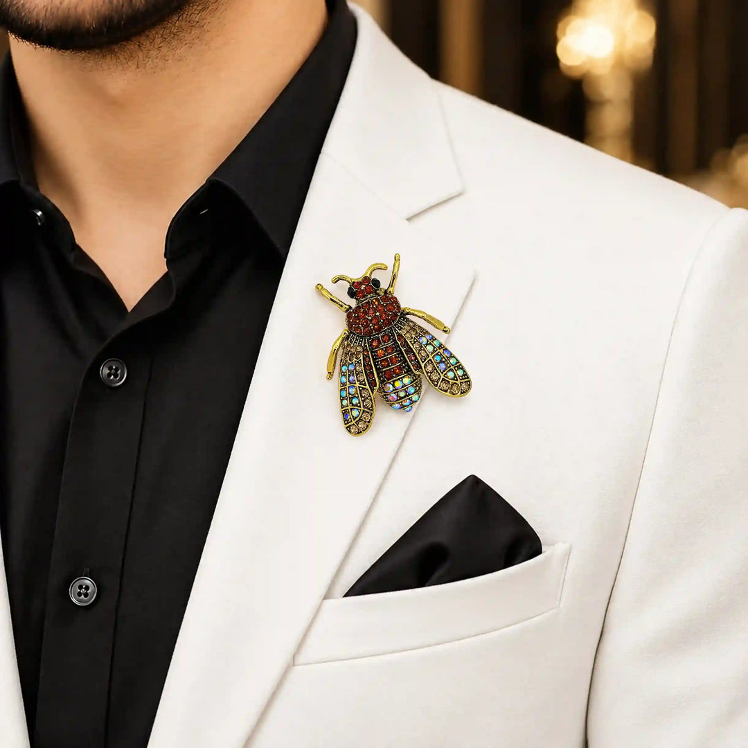 ANI Accessories brown honeybee crystal brooch on a man's white party blazer 