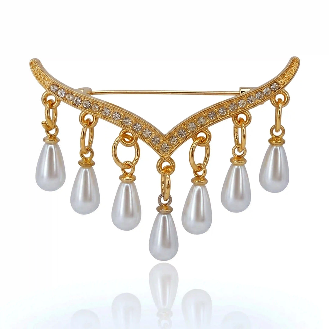 ANI Accessories chevron tassel pearl brooch pin with gold V-shaped rhinestone bar and seven pearl drops with white color background 