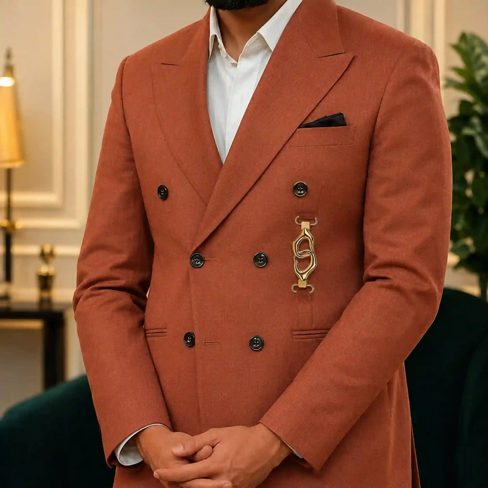 ANI Accessories gold coat buckle used as the front closure on a rust double-breasted blazer 