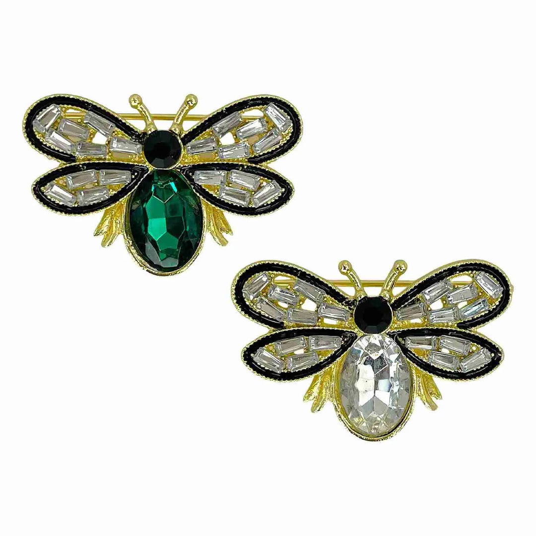 Emerald and white crystal bee brooches side by side with white color background 