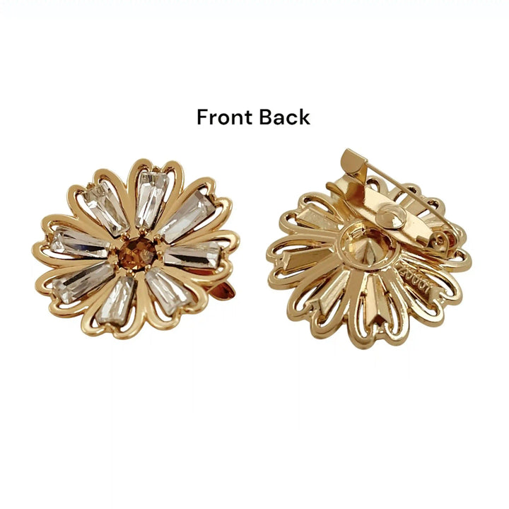 ANI Accessories daisy flower brooch showing the crystal front and the pin on the back with white color background 