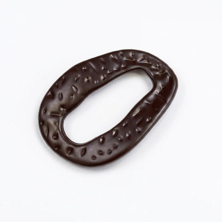 ANI Accessories dark brown hammered oval ring buckle with glossy pitted texture and open centre, angled view With white color background 