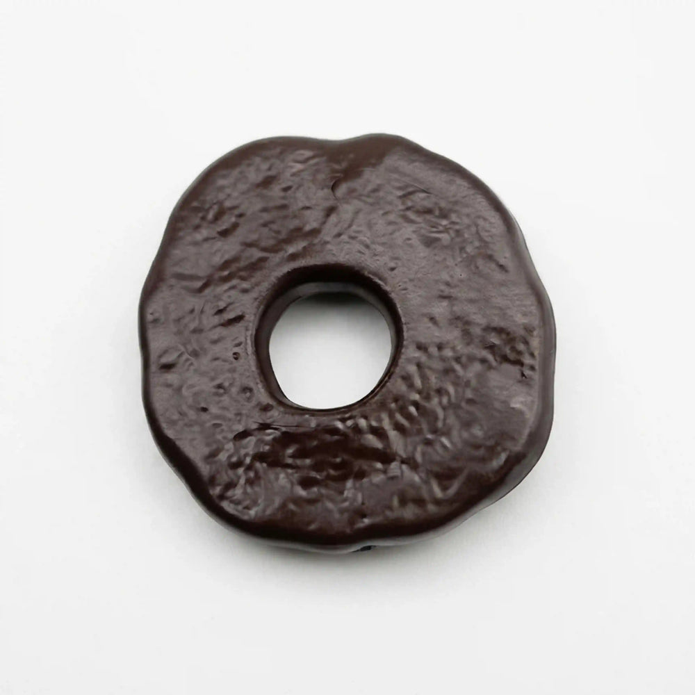 ANI Accessories dark brown textured donut pendant charm, angled view of the hammered-look surface and thick rounded edge With white color background 