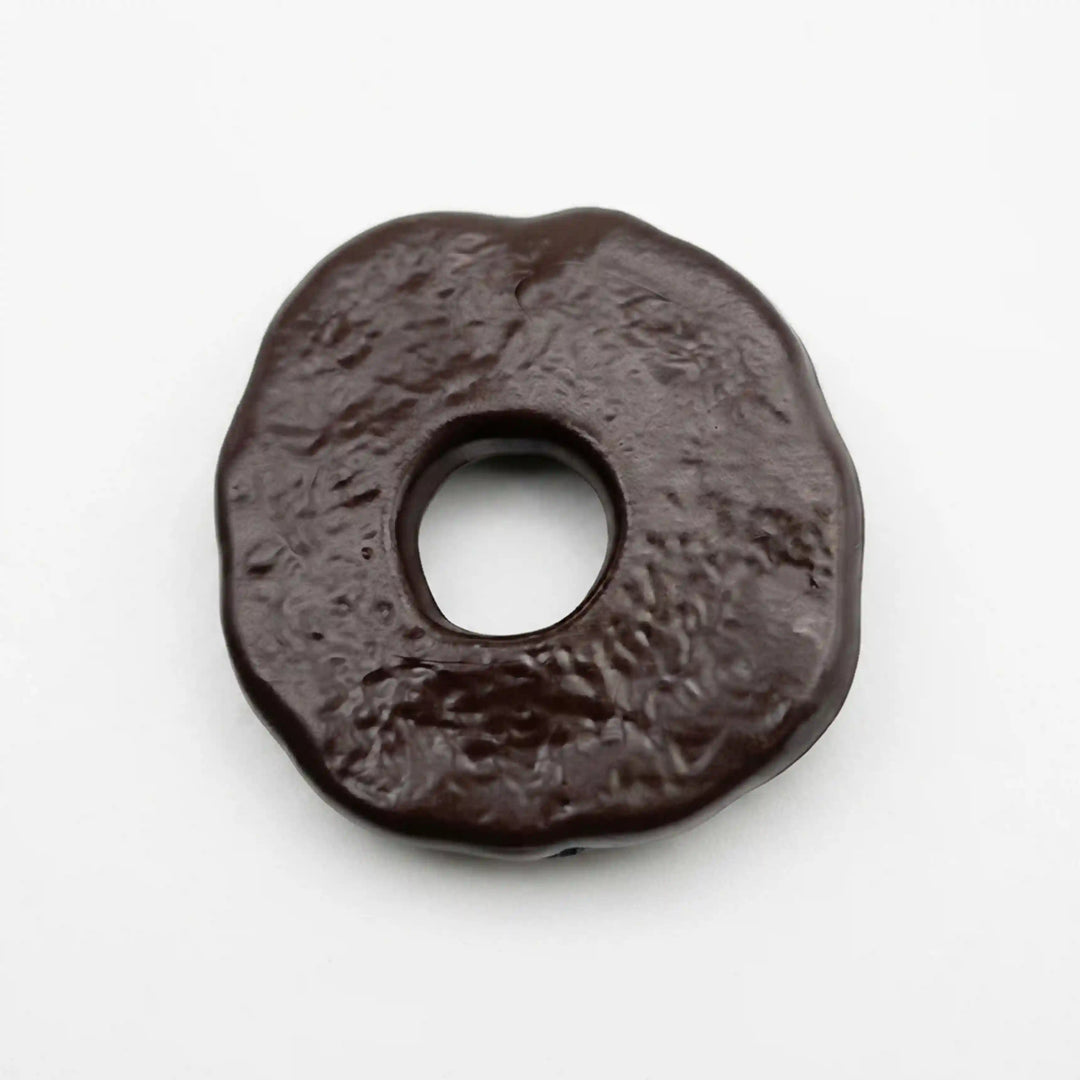 ANI Accessories dark brown textured donut pendant charm, angled view of the hammered-look surface and thick rounded edge With white color background 