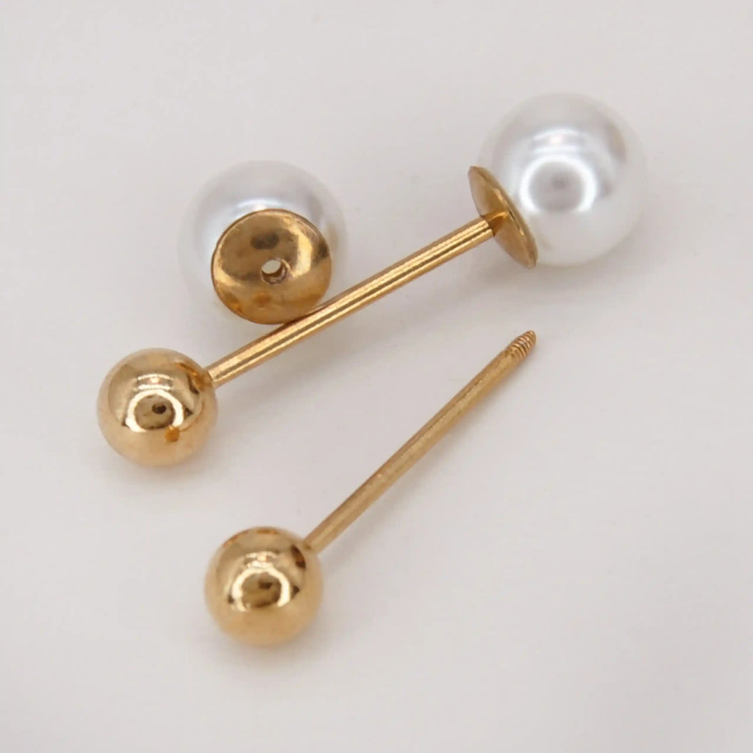 Dual pearl pin shown open with the gold ball removed from the bar with white color background 