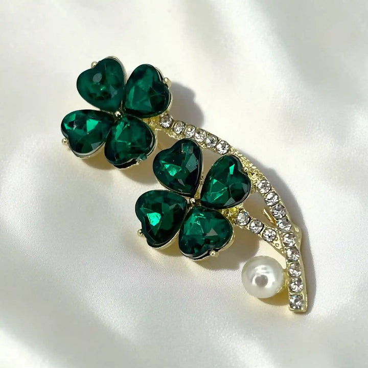 ANI Accessories emerald brooch for women with green crystal clovers, rhinestone gold stem and pearl on white satin 