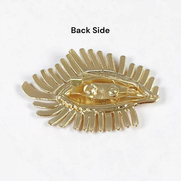 ANI Accessories evil eye brooch back side showing the gold base and pin with white color background 