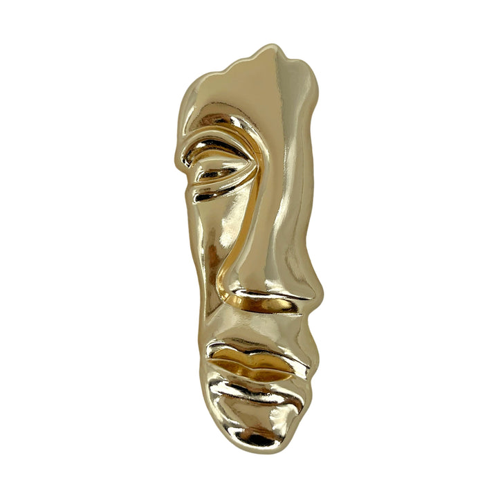 ANI Accessories gold abstract metal brooch with flowing facial features on white 