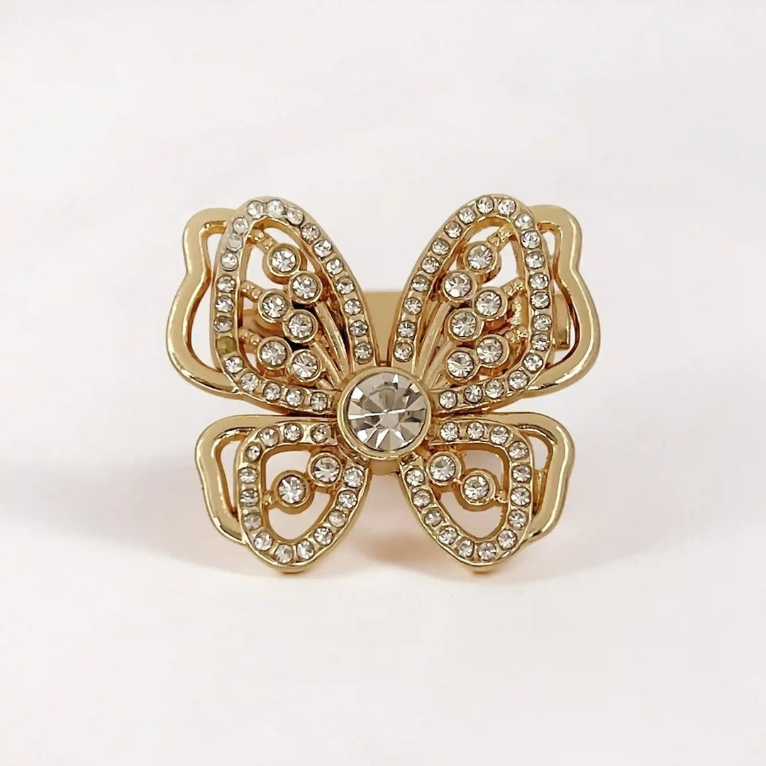 ANI Accessories butterfly rhinestone brooch in gold with layered wings and a crystal centre, on satin 