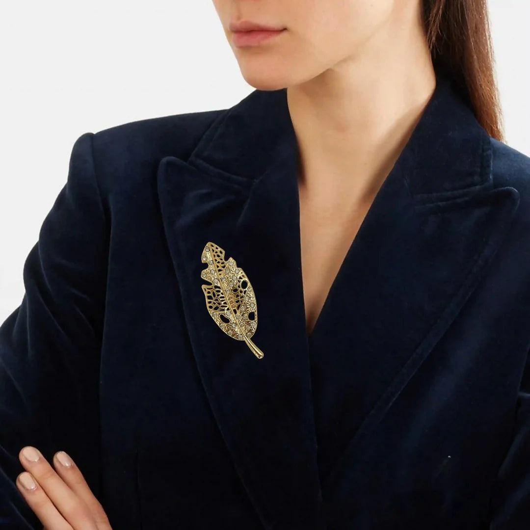 ANI Accessories gold leaf brooch for women pinned on a navy blazer 