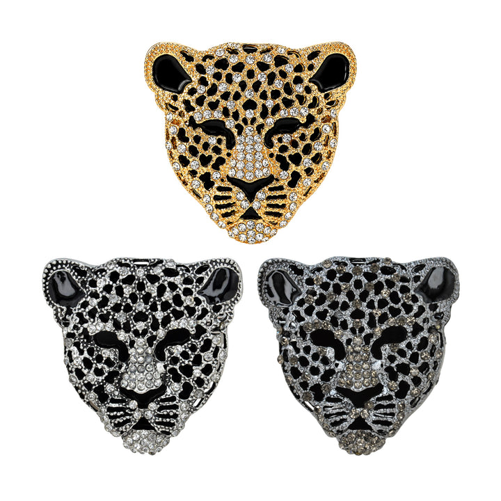 ANI Accessories gold, silver and gunmetal leopard brooches arranged together on white 