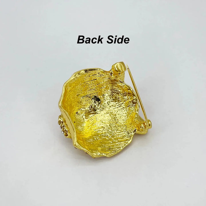 Back side of the gold tiger brooch showing the brooch pin with white color background written text back side 