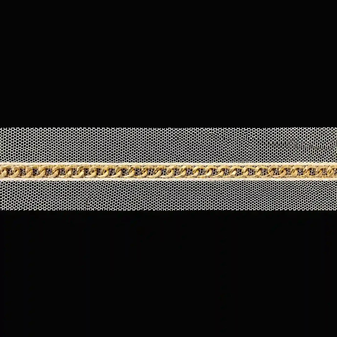 ANI Accessories golden chain lace on cream net laid flat with black color background 