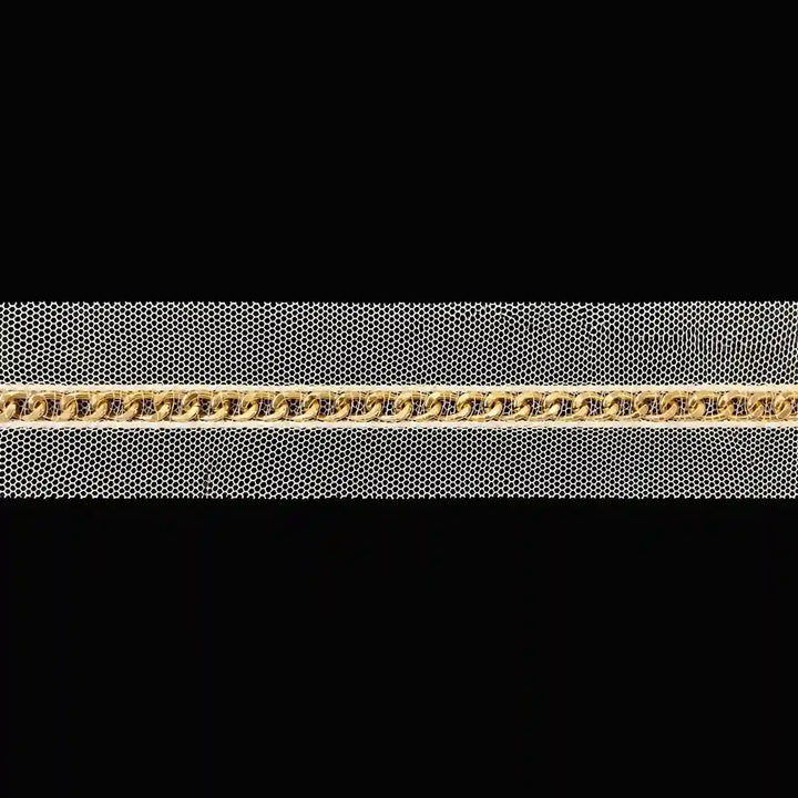 ANI Accessories golden chain lace on cream net laid flat with black color background 