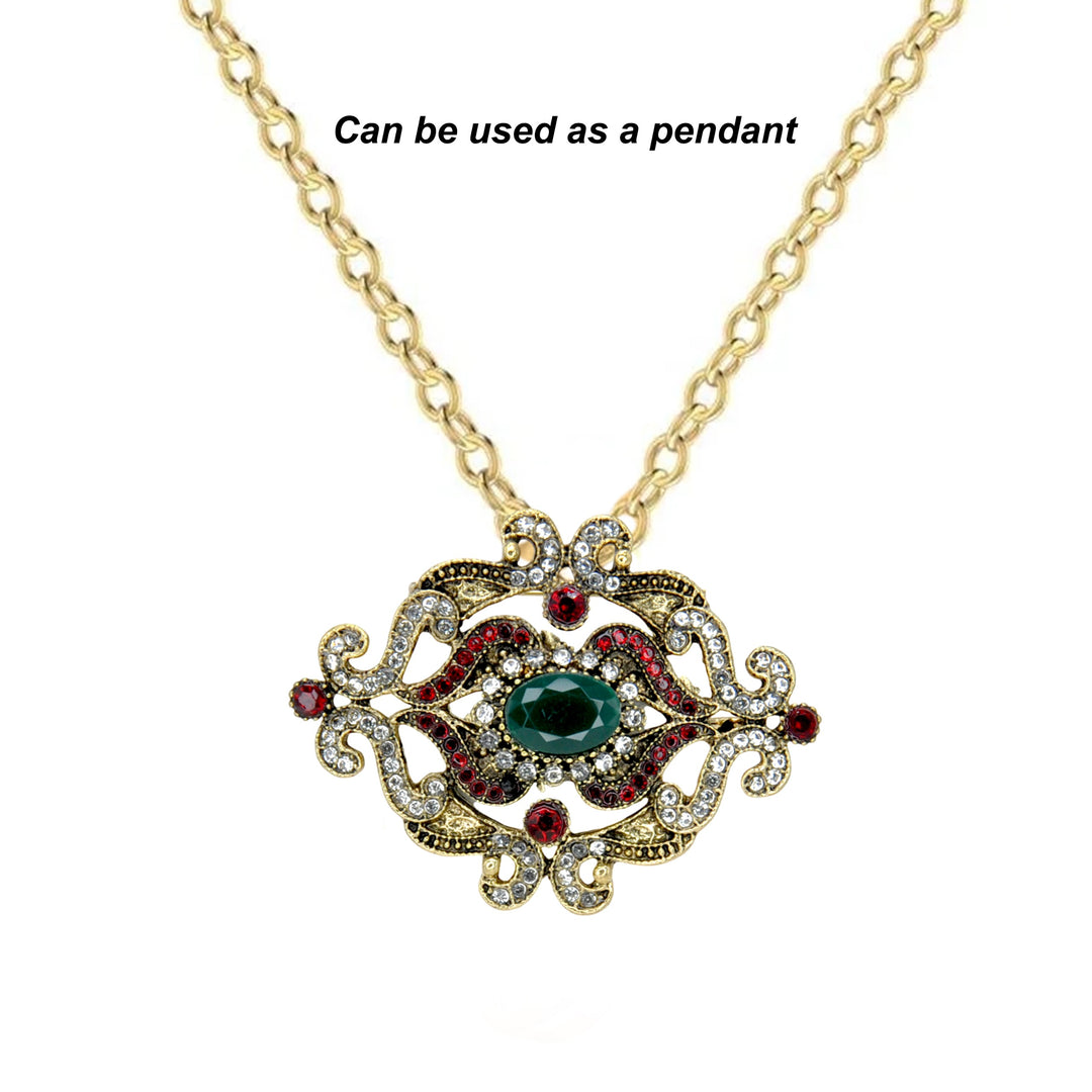 ANI Accessories green stone baroque brooch worn as a pendant on a gold chain 