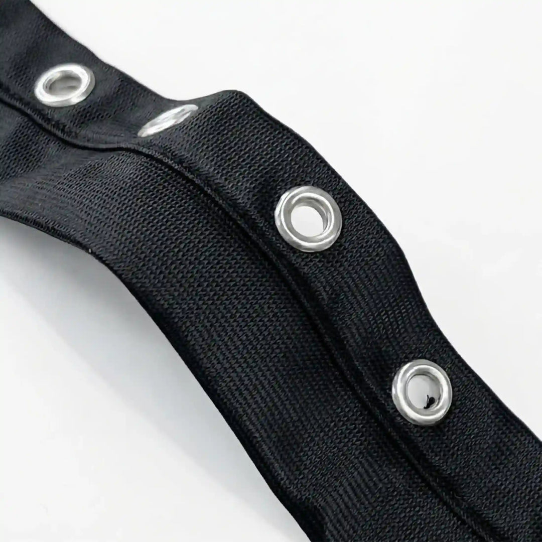ANI Accessories close-up of open metal eyelets on black grommet tape for clothes with white color background 