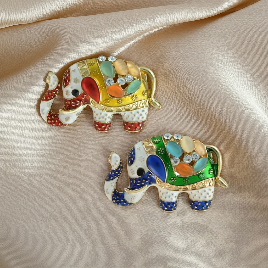 ANI Accessories jeweled elephant brooch pins in yellow and green enamel on beige satin