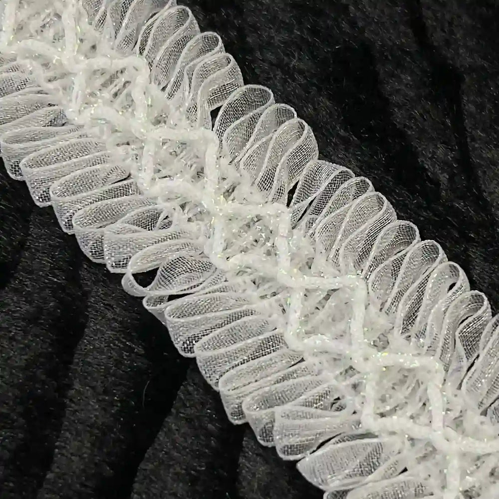 ANI Accessories close-up of loop fringe trim with diamond cord centre with black color background 