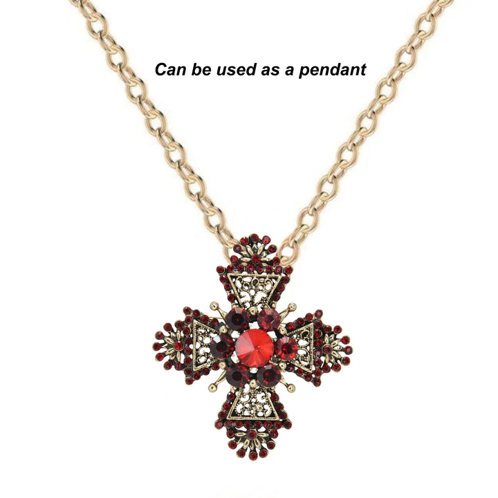 ANI Accessories maltese cross brooch worn as a pendant on a gold chain 