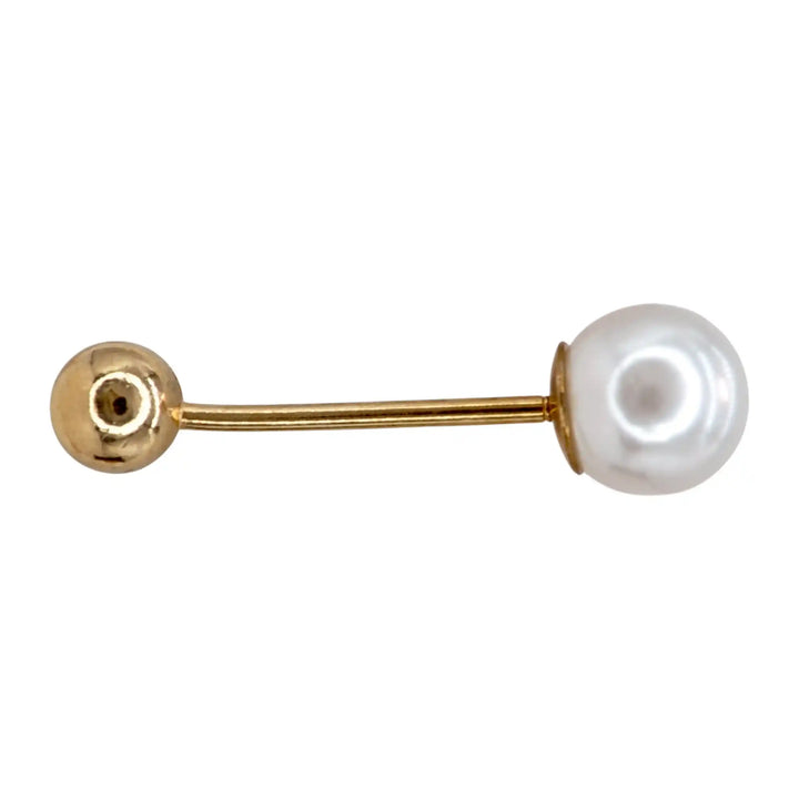 Single pearl and gold ball bar pin on white background 