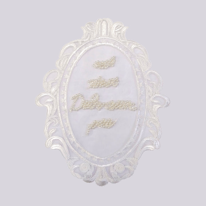 ANI Accessories pearl patch for dress with ornate scroll leaf frame, on light grey 