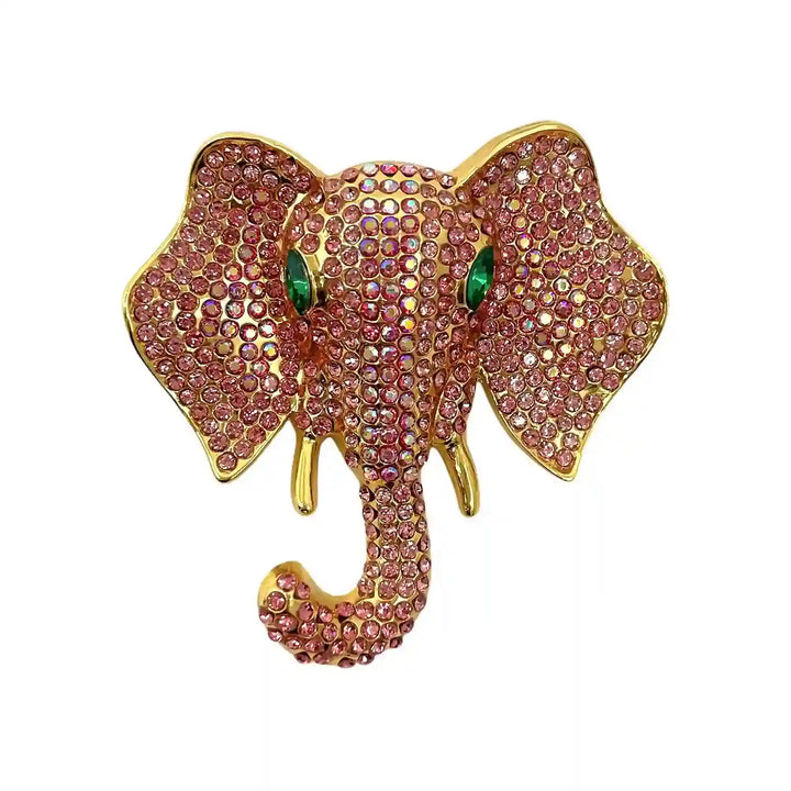 ANI Accessories light pink elephant brooch with pavé rhinestones and green crystal eyes with white color background 