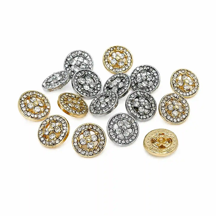 ANI Accessories mixed set of silver and gold quatrefoil rhinestone metal buttons scattered on white Background 