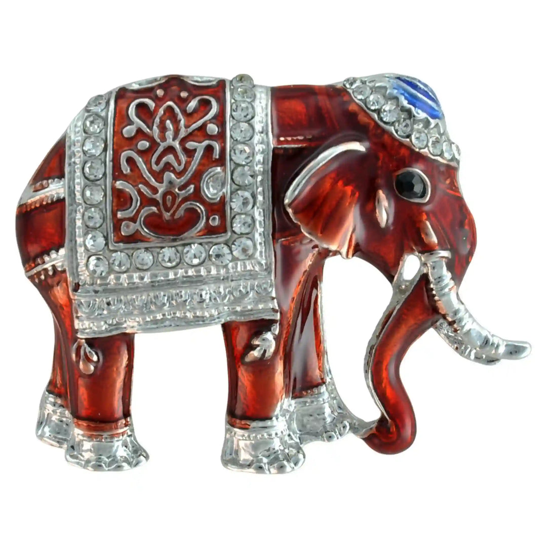 Red enamel elephant brooch with silver-tone trims and rhinestone saddle cloth color background 