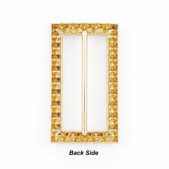 ANI Accessories rectangular rhinestone gold belt buckle back side, showing open-back stone settings and central bar.