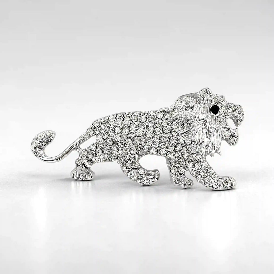 ANI Accessories roaring lion brooch with clear rhinestone body and black crystal eye, front view 