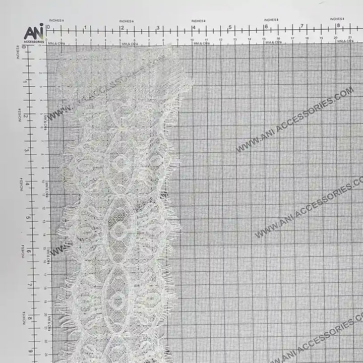 Scalloped Edge Eyelash Lace in delicate white, perfect for crafting and sewing projects