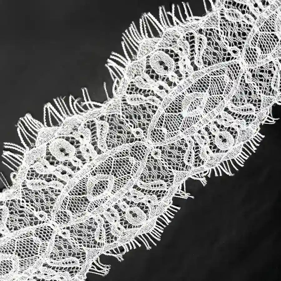 White Scalloped Edge Eyelash Lace with Intricate Patterns for Crafting and Fashion Projects