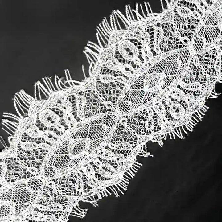 White Scalloped Edge Eyelash Lace with Intricate Patterns for Crafting and Fashion Projects