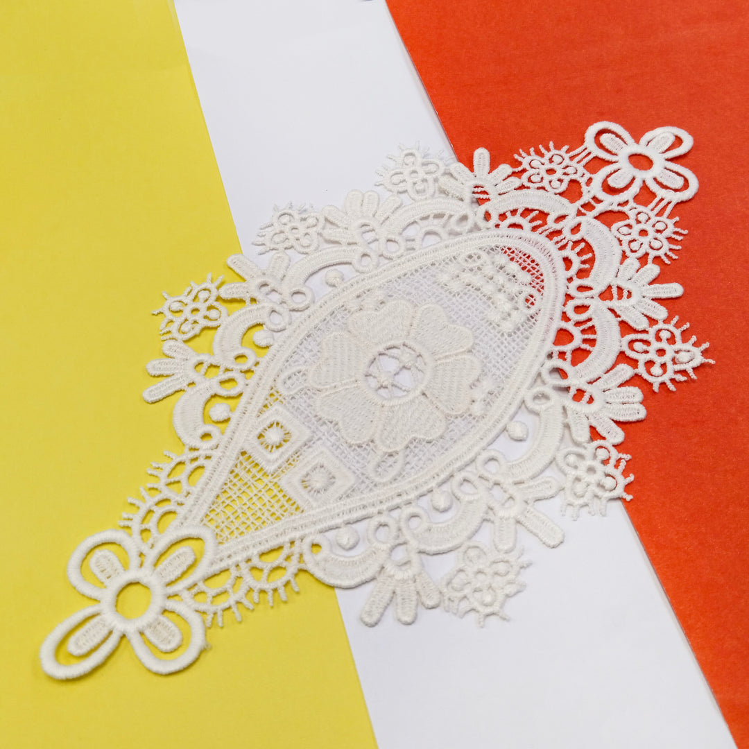 ANI Accessories sew-on applique patch with scroll border, angled view on a colour background