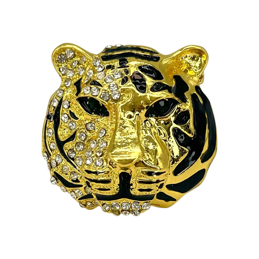 Shiny gold rhinestone tiger brooch with black enamel stripes and black eyes with white color background 