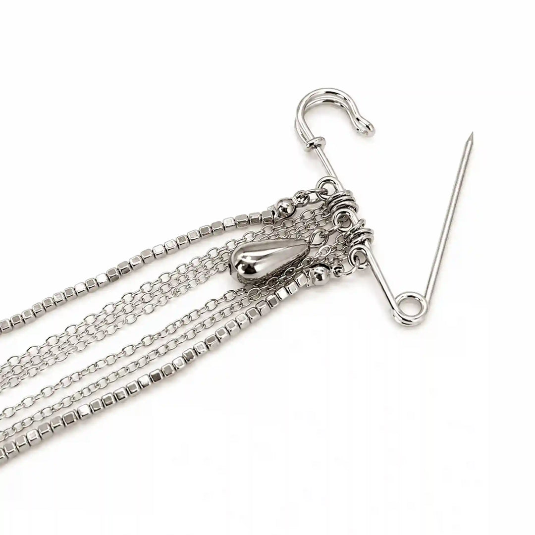 ANI Accessories silver chain tassel brooch close-up showing the safety pin clasp and chain links with white color background 