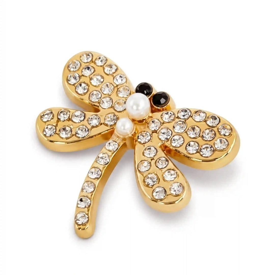 Small gold dragonfly rhinestone brooch on white background with white color background 