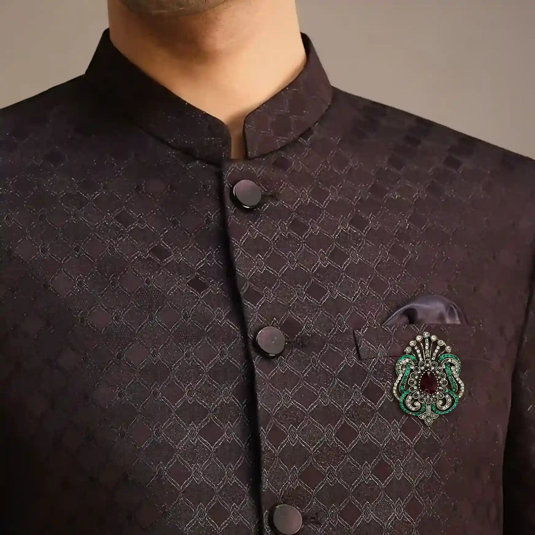 ANI Accessories Victorian rhinestone brooch pinned on the chest of a dark bandhgala jodhpuri suit 