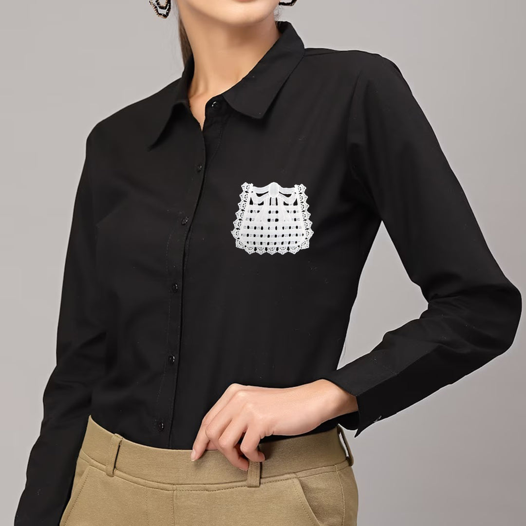 ANI Accessories white bow pocket patch stitched on the chest of a woman's black shirt 