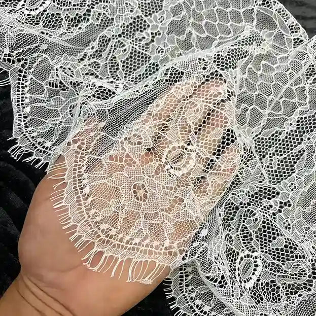 ANI Accessories white Chantilly lace held in hand to show the honeycomb net